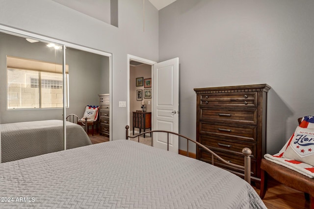 bedroom with hardwood / wood-style flooring