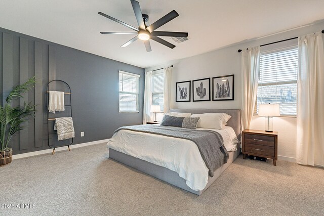 bedroom featuring baseboards, a ceiling fan, and carpet flooring