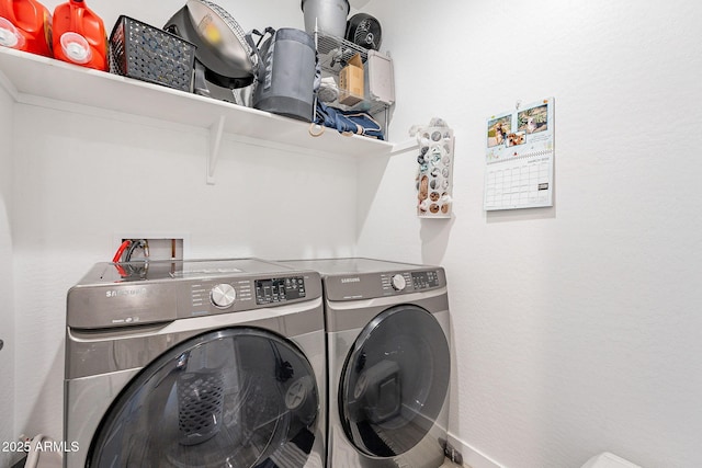 washroom featuring laundry area and washer and dryer