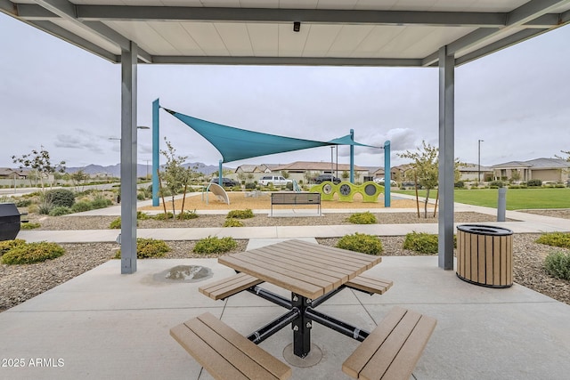 view of patio / terrace with playground community and a residential view