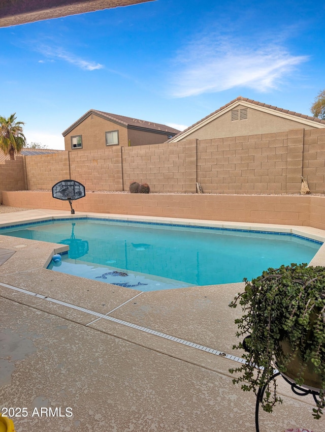 view of swimming pool featuring a fenced backyard and a fenced in pool