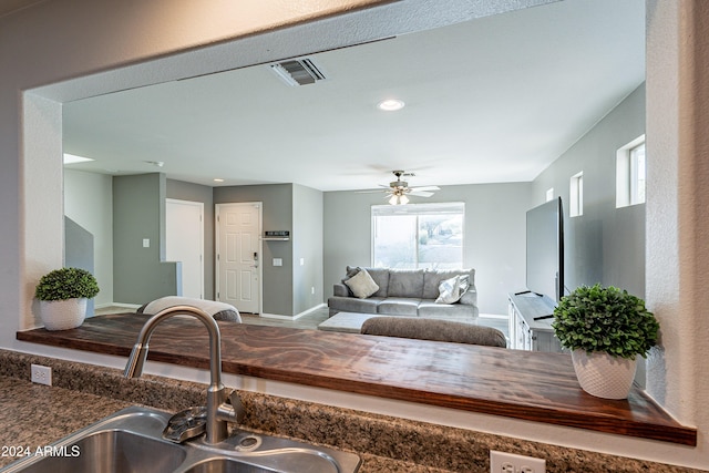 kitchen with ceiling fan and sink