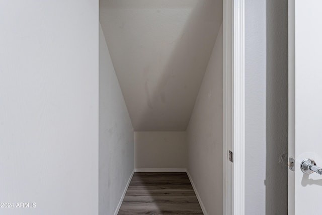 interior space with hardwood / wood-style floors and lofted ceiling