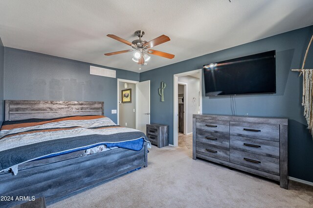 bedroom featuring ceiling fan and light colored carpet