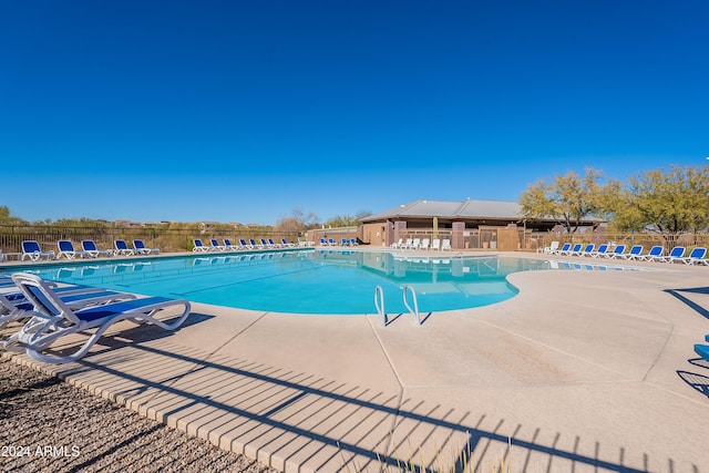 view of swimming pool featuring a patio area