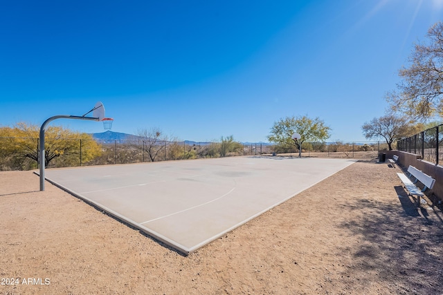 view of sport court with a mountain view