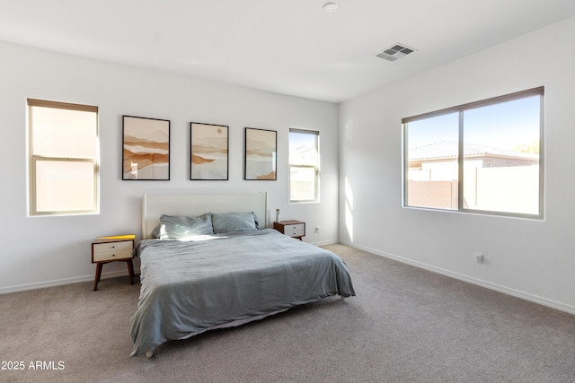 bedroom featuring light carpet