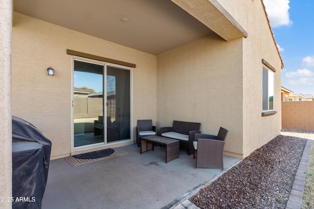 view of patio with grilling area and an outdoor living space