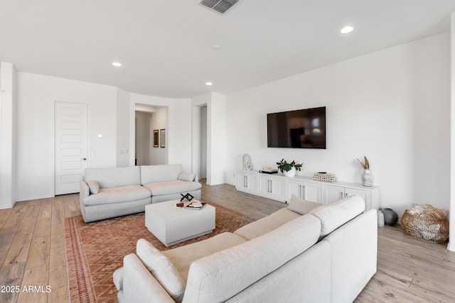 living room with light hardwood / wood-style floors