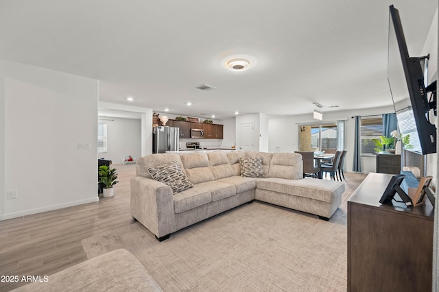 living room with light hardwood / wood-style floors