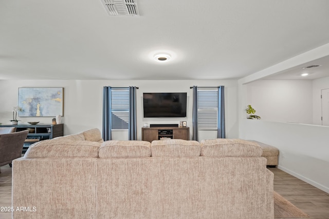 living room with light hardwood / wood-style flooring