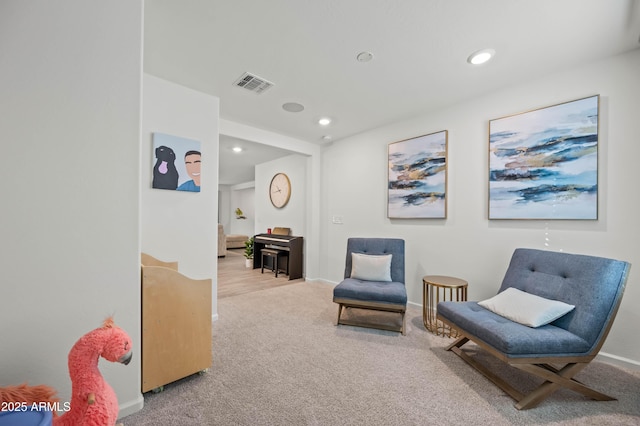 sitting room with carpet flooring