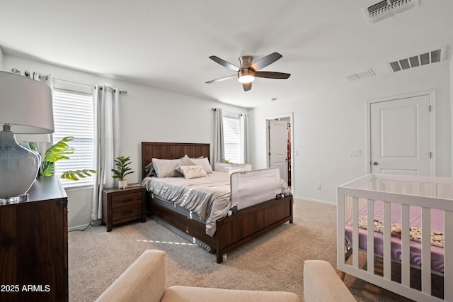 carpeted bedroom featuring ceiling fan