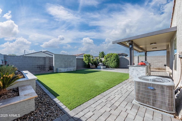 view of yard with a patio area and central AC