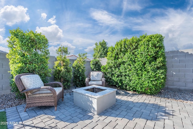 view of patio featuring a fire pit