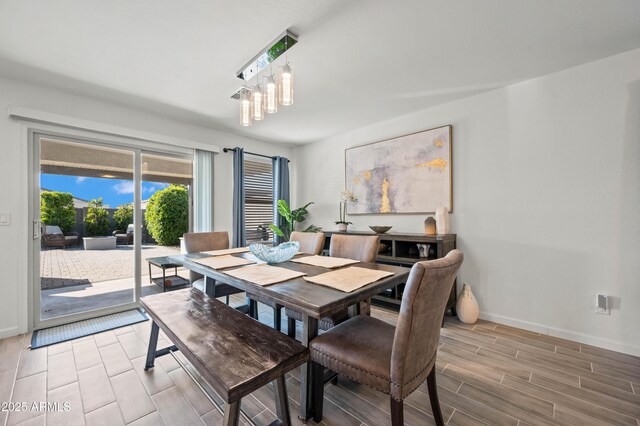 dining space with a notable chandelier