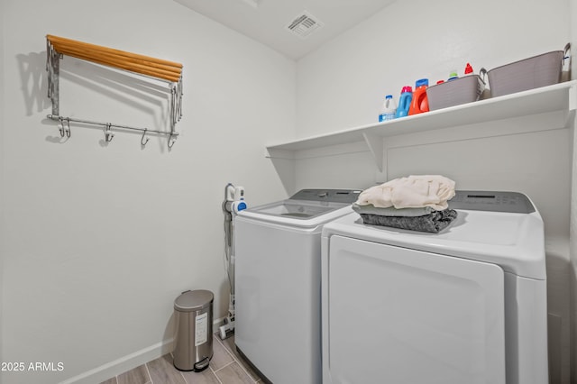 clothes washing area featuring washer and clothes dryer