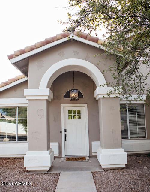 3446 N Ravine, Mesa, AZ 85215 - doorway to property featuring stucco siding