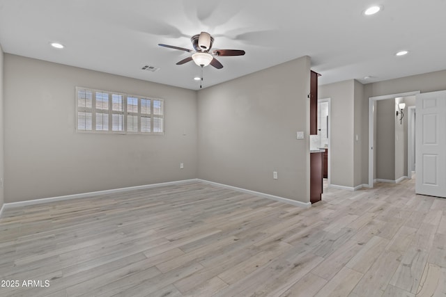 9917 W Cameo Dr, Sun City, AZ 85351 - spare room with a ceiling fan, light wood-style flooring, recessed lighting, and baseboards