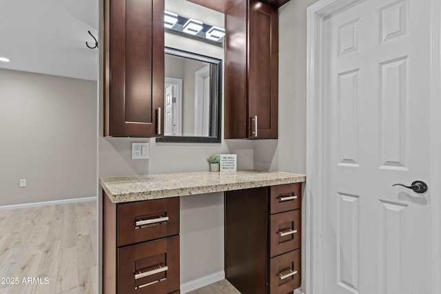 9917 W Cameo Dr, Sun City, AZ 85351 - bathroom featuring wood finished floors, vanity, and baseboards