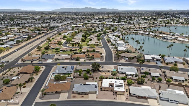 9917 W Cameo Dr, Sun City, AZ 85351 - aerial overview of property's location with nearby suburban area and a water and mountain view