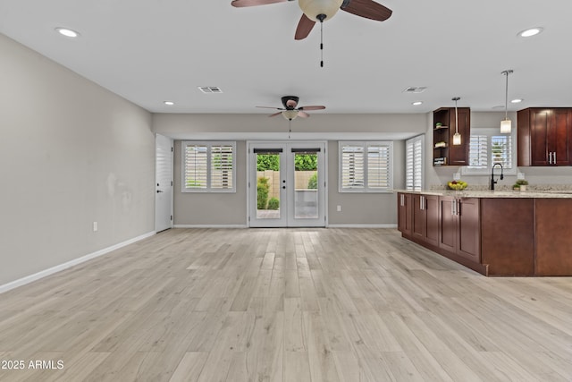 9917 W Cameo Dr, Sun City, AZ 85351 - kitchen with a ceiling fan, light wood-style flooring, healthy amount of natural light, and recessed lighting