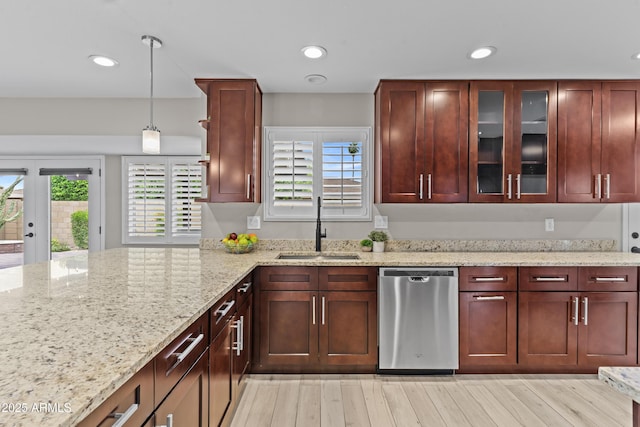 9917 W Cameo Dr, Sun City, AZ 85351 - kitchen featuring dishwasher, a sink, recessed lighting, light stone countertops, and glass insert cabinets