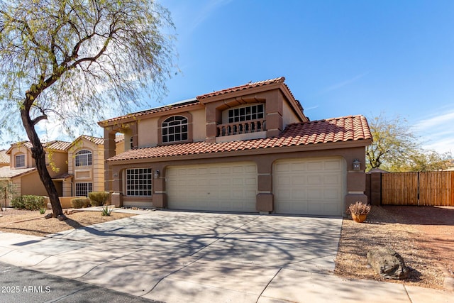 mediterranean / spanish home featuring a garage, driveway, a tile roof, fence, and stucco siding