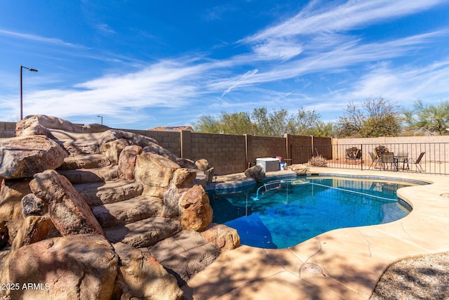 view of pool with a fenced in pool, a fenced backyard, and central air condition unit