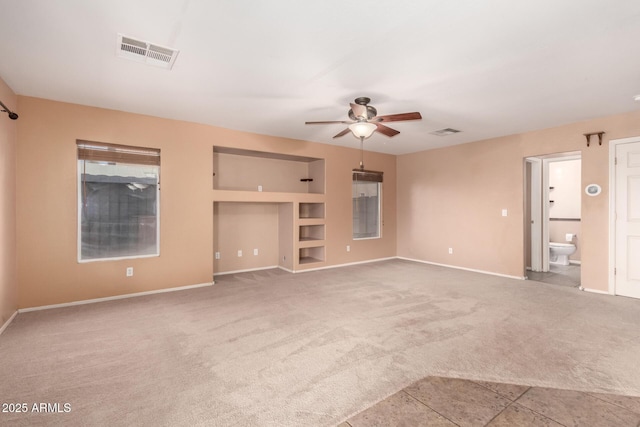 unfurnished living room with light carpet, baseboards, visible vents, and a ceiling fan