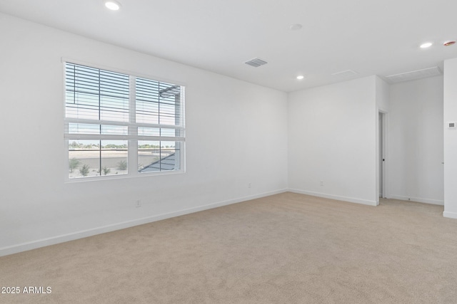 unfurnished room with light colored carpet