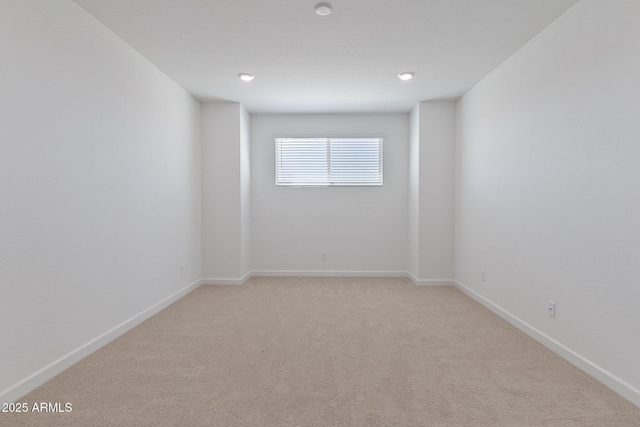 spare room with light colored carpet