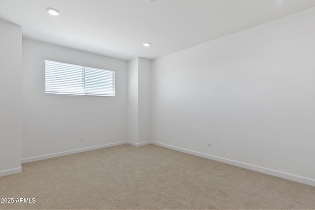 empty room featuring light colored carpet