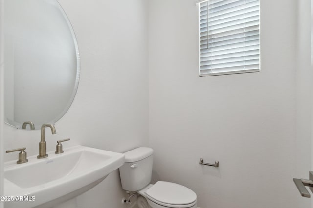 bathroom with sink and toilet