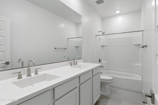 full bathroom with tile patterned flooring, vanity, shower / tub combination, and toilet