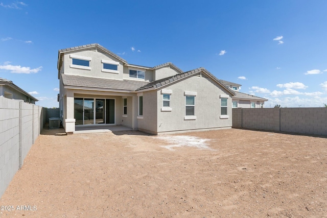 rear view of property featuring a patio