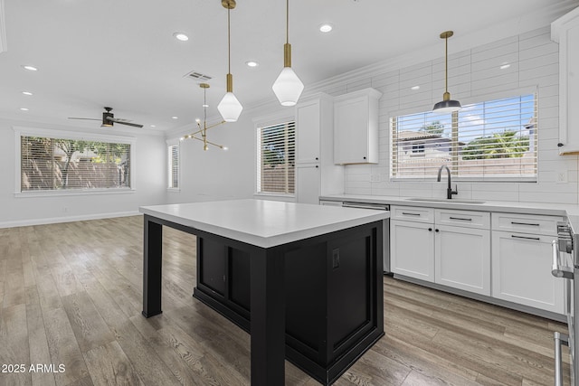 18998 E Lark Dr, Queen Creek, AZ 85142 - kitchen with a sink, crown molding, light countertops, tasteful backsplash, and recessed lighting