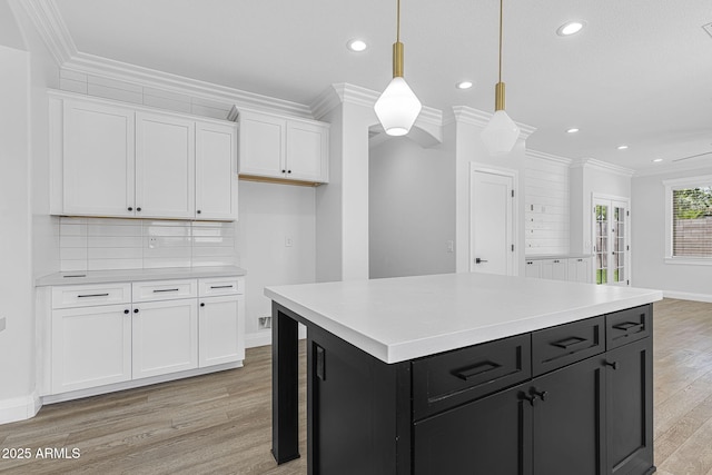 18998 E Lark Dr, Queen Creek, AZ 85142 - kitchen featuring dark cabinets, white cabinetry, recessed lighting, light wood-style flooring, and light countertops