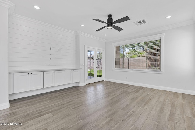 18998 E Lark Dr, Queen Creek, AZ 85142 - unfurnished room featuring light wood-style floors, ceiling fan, baseboards, recessed lighting, and crown molding