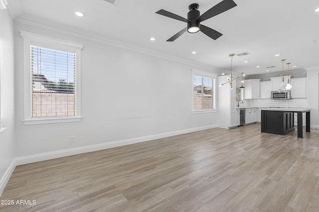 18998 E Lark Dr, Queen Creek, AZ 85142 - unfurnished living room featuring ornamental molding, light wood-type flooring, baseboards, recessed lighting, and a ceiling fan