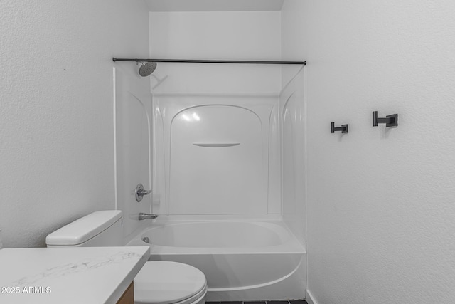 18998 E Lark Dr, Queen Creek, AZ 85142 - bathroom with toilet, vanity, shower / bathtub combination, and a textured wall