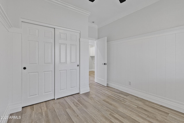 18998 E Lark Dr, Queen Creek, AZ 85142 - unfurnished bedroom featuring light wood finished floors, crown molding, a closet, ceiling fan, and baseboards