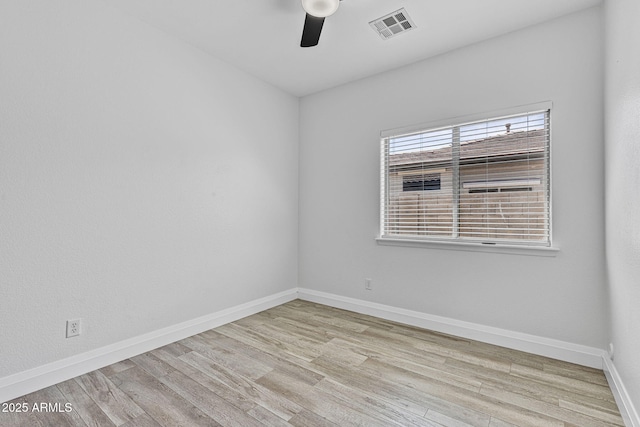 18998 E Lark Dr, Queen Creek, AZ 85142 - spare room featuring ceiling fan, wood finished floors, and baseboards
