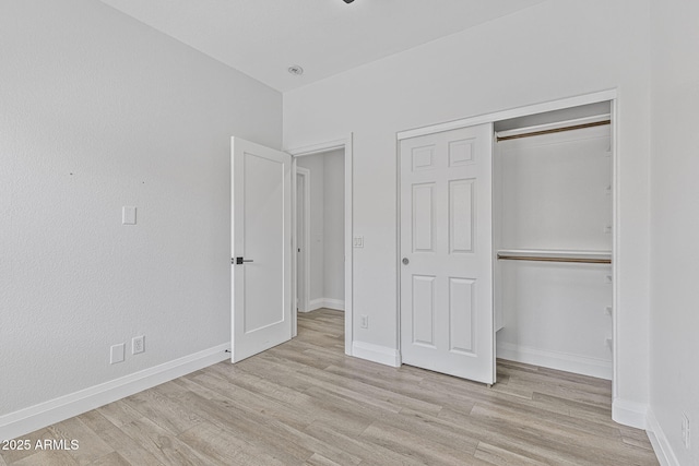18998 E Lark Dr, Queen Creek, AZ 85142 - unfurnished bedroom featuring light wood finished floors, a closet, and baseboards
