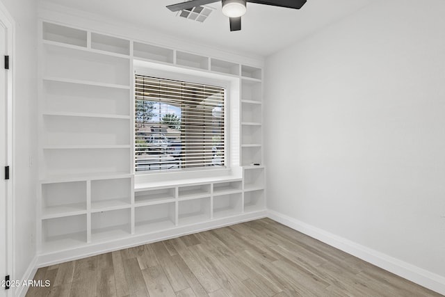 18998 E Lark Dr, Queen Creek, AZ 85142 - empty room with a ceiling fan, wood finished floors, and baseboards