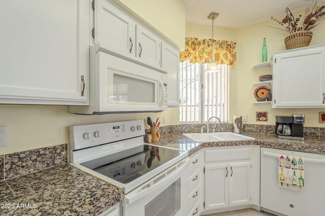 kitchen with white appliances, white cabinets, open shelves, and a sink