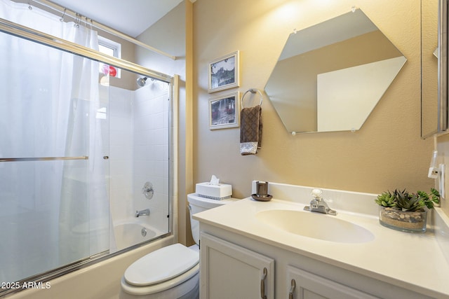 bathroom featuring vanity, toilet, and enclosed tub / shower combo