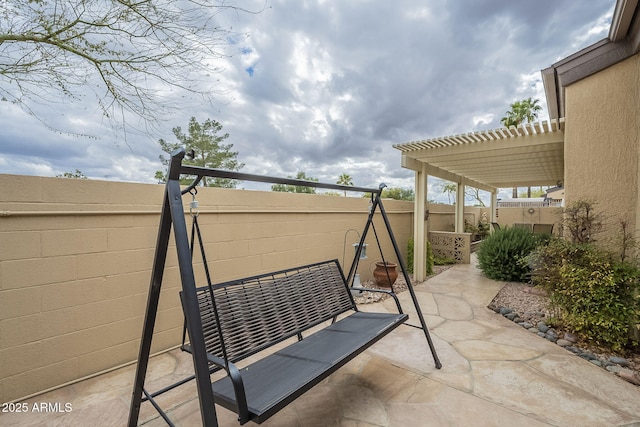 view of patio featuring a fenced backyard and a pergola