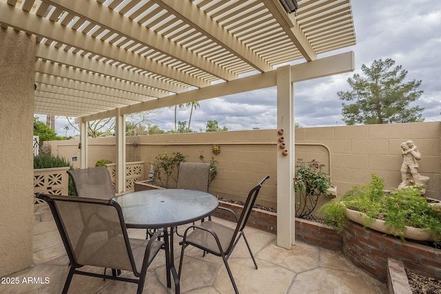 view of patio / terrace with outdoor dining space, a pergola, and a fenced backyard