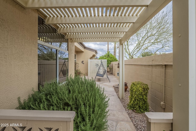 view of patio / terrace featuring a fenced backyard and a pergola